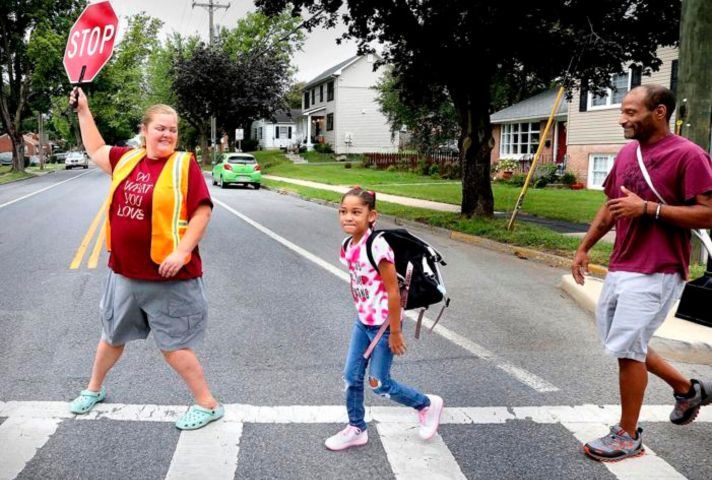  crossing guard helping family