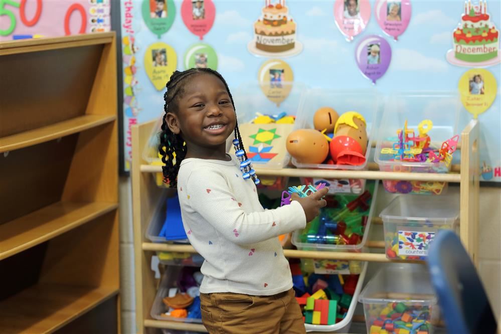  Preschool student playing in the classroom